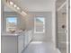 Bright bathroom featuring double vanity, large mirror, recessed lighting, and tiled glass shower at 132 Dalston Cv, Stockbridge, GA 30281