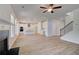 Open concept living room, kitchen and dining area with hardwood floors and light gray walls at 132 Dalston Cv, Stockbridge, GA 30281