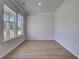 Bright room with natural light and wood floors is waiting for your personal touch at 132 Dalston Cv, Stockbridge, GA 30281