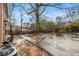 Backyard featuring a concrete patio, air conditioning equipment and bare trees at 2367 Cascade Sw Rd # 9C, Atlanta, GA 30311