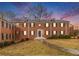 Exterior shot of a red brick apartment building with manicured lawns at sunset at 2367 Cascade Sw Rd # 9C, Atlanta, GA 30311