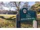The First Tee park sign is surrounded by lush greenery and peaceful trees, for the John A. White Park at 2367 Cascade Sw Rd # 9C, Atlanta, GA 30311