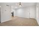 Inviting living room with modern ceiling fan, plush carpeting, and access to the kitchen at 2367 Cascade Sw Rd # 9C, Atlanta, GA 30311