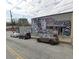 Unique street view featuring vibrant mural art and nearby commercial properties, creating an energetic neighborhood atmosphere at 2367 Cascade Sw Rd # 9C, Atlanta, GA 30311