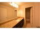 Bathroom features granite countertops, a large mirror, and a tile floor for added elegance at 2417 Overlook Ave, Lithonia, GA 30058