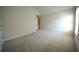 Bedroom boasts sloped ceiling, a window for natural light, and carpet for comfort at 2417 Overlook Ave, Lithonia, GA 30058