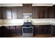 Kitchen showcases modern stainless steel gas range and ample cabinet space at 2417 Overlook Ave, Lithonia, GA 30058