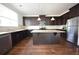 Well-equipped kitchen with stainless steel appliances, granite countertops, and central island at 2417 Overlook Ave, Lithonia, GA 30058