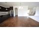 Spacious area with wood flooring offering a view of kitchen and stairs at 2417 Overlook Ave, Lithonia, GA 30058