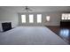 Spacious living room featuring plush carpeting and ample natural light at 2417 Overlook Ave, Lithonia, GA 30058