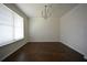 Empty living room with hardwood floors and natural light at 2417 Overlook Ave, Lithonia, GA 30058