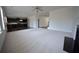 Open-concept living area combines plush carpet and hardwood flooring at 2417 Overlook Ave, Lithonia, GA 30058