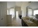 Bright main bathroom featuring double vanities, a soaking tub, and a glass shower at 2417 Overlook Ave, Lithonia, GA 30058