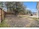 Expansive fenced backyard featuring mature trees offering shade and privacy at 1921 Boulder Gate Dr, Ellenwood, GA 30294