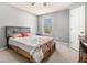 Light filled bedroom featuring neutral walls, a comfortable bed, and a well lit window at 1921 Boulder Gate Dr, Ellenwood, GA 30294