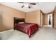 Spacious tan bedroom with a ceiling fan and closet, along with a adjacent doorway at 1921 Boulder Gate Dr, Ellenwood, GA 30294