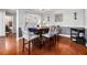 Dining area featuring hardwood floors, stylish decor, and seating for four at 1921 Boulder Gate Dr, Ellenwood, GA 30294