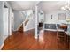 Inviting entryway with hardwood floors, staircase, and view into the dining area at 1921 Boulder Gate Dr, Ellenwood, GA 30294