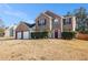 Charming brick home with a well-manicured front yard and inviting entryway at 1921 Boulder Gate Dr, Ellenwood, GA 30294