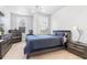 This bedroom boasts neutral walls and carpet with two bright, natural light filled windows and modern furniture at 2363 Palladian Manor Se Way # 4, Atlanta, GA 30339