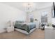 Well-lit bedroom featuring a modern platform bed, contemporary lighting, and a dedicated workspace at 2363 Palladian Manor Se Way # 4, Atlanta, GA 30339