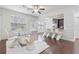 Elegant dining area with hardwood floors, white furnishings, and abundant natural light at 2363 Palladian Manor Se Way # 4, Atlanta, GA 30339