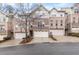 Charming brick townhome featuring an attached two-car garage and well-manicured landscaping at 2363 Palladian Manor Se Way # 4, Atlanta, GA 30339