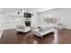 Contemporary living room with dark wood floors, white walls, modern furniture, and a fireplace at 2363 Palladian Manor Se Way # 4, Atlanta, GA 30339