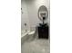 Bathroom featuring a modern vanity, toilet, tub and shower combination with unique tile details at 3260 Valley Bend Rd, Atlanta, GA 30349