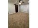 Bedroom with carpet flooring, a ceiling fan, a large window and a barn-style closet door at 3260 Valley Bend Rd, Atlanta, GA 30349