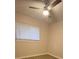 Cozy bedroom featuring neutral walls, a ceiling fan, and a window with blinds at 3260 Valley Bend Rd, Atlanta, GA 30349