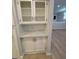 Charming built-in cabinet with glass doors, granite counters, and lower cabinets for added storage at 3260 Valley Bend Rd, Atlanta, GA 30349