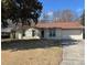 Charming single-story home with a well-maintained lawn, brick facade, and attached garage at 3260 Valley Bend Rd, Atlanta, GA 30349