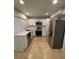 Well-lit kitchen with stainless steel appliances, white cabinetry, and plenty of counter space at 3260 Valley Bend Rd, Atlanta, GA 30349