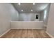 Open living area with laminate flooring, natural light, and modern fixtures throughout at 3260 Valley Bend Rd, Atlanta, GA 30349