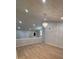 Open living room featuring vaulted ceiling, hardwood floors, and a decorative chandelier at 3260 Valley Bend Rd, Atlanta, GA 30349