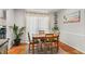 Light-filled dining area adjacent to the kitchen with terracotta floors at 5558 Kingsport Dr # 27, Atlanta, GA 30342