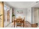 Bright dining room with sliding glass doors to the patio and terracotta floors at 5558 Kingsport Dr # 27, Atlanta, GA 30342
