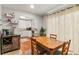 Open concept dining area with natural light, terracotta floor, and modern kitchen at 5558 Kingsport Dr # 27, Atlanta, GA 30342