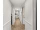 Hallway with neutral carpet, and white trim at 5558 Kingsport Dr # 27, Atlanta, GA 30342