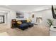 Cozy living room with a blue sofa, neutral walls, carpet, and artwork creating a serene space at 5558 Kingsport Dr # 27, Atlanta, GA 30342