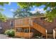 Patio with wood railing and steps at 5558 Kingsport Dr # 27, Atlanta, GA 30342
