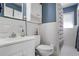 Stylish bathroom with modern fixtures, white tile, shower and a built-in vanity at 933 Vistavia Cir, Decatur, GA 30033