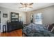 Comfortable bedroom with modern decor, hardwood floors and a large window at 933 Vistavia Cir, Decatur, GA 30033