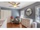 Comfortable Bedroom with wood floors, a glider chair, and bright natural light at 933 Vistavia Cir, Decatur, GA 30033