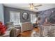 Bright Bedroom featuring hardwood floors, a modern changing table and a whimsical mural at 933 Vistavia Cir, Decatur, GA 30033