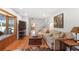 Inviting living room featuring a large bay window, hardwood floors, comfortable seating, and stylish decor at 933 Vistavia Cir, Decatur, GA 30033