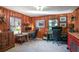 Spacious home office with warm wood paneling, custom cabinets, and multiple workstations at 933 Vistavia Cir, Decatur, GA 30033
