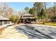 Beautiful backyard with a pool, deck, and covered patio area at 1435 Jay Ct, Snellville, GA 30078