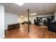 Open basement featuring wood-look floors, a TV area, and a functional workspace at 1435 Jay Ct, Snellville, GA 30078